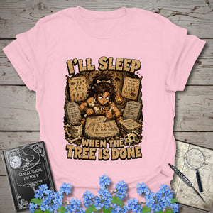 I’ll Sleep When the Tree Is Done – Cavewoman Edition T-Shirt in Light Pink by Genealogy Keepsakes