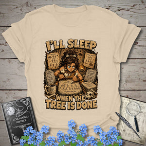I’ll Sleep When the Tree Is Done – Cavewoman Edition T-Shirt in Natural by Genealogy Keepsakes