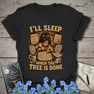 I’ll Sleep When the Tree Is Done – Cavewoman Edition T-Shirt in Black by Genealogy Keepsakes