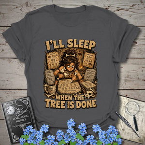 I’ll Sleep When the Tree Is Done – Cavewoman Edition T-Shirt in Charcoal by Genealogy Keepsakes