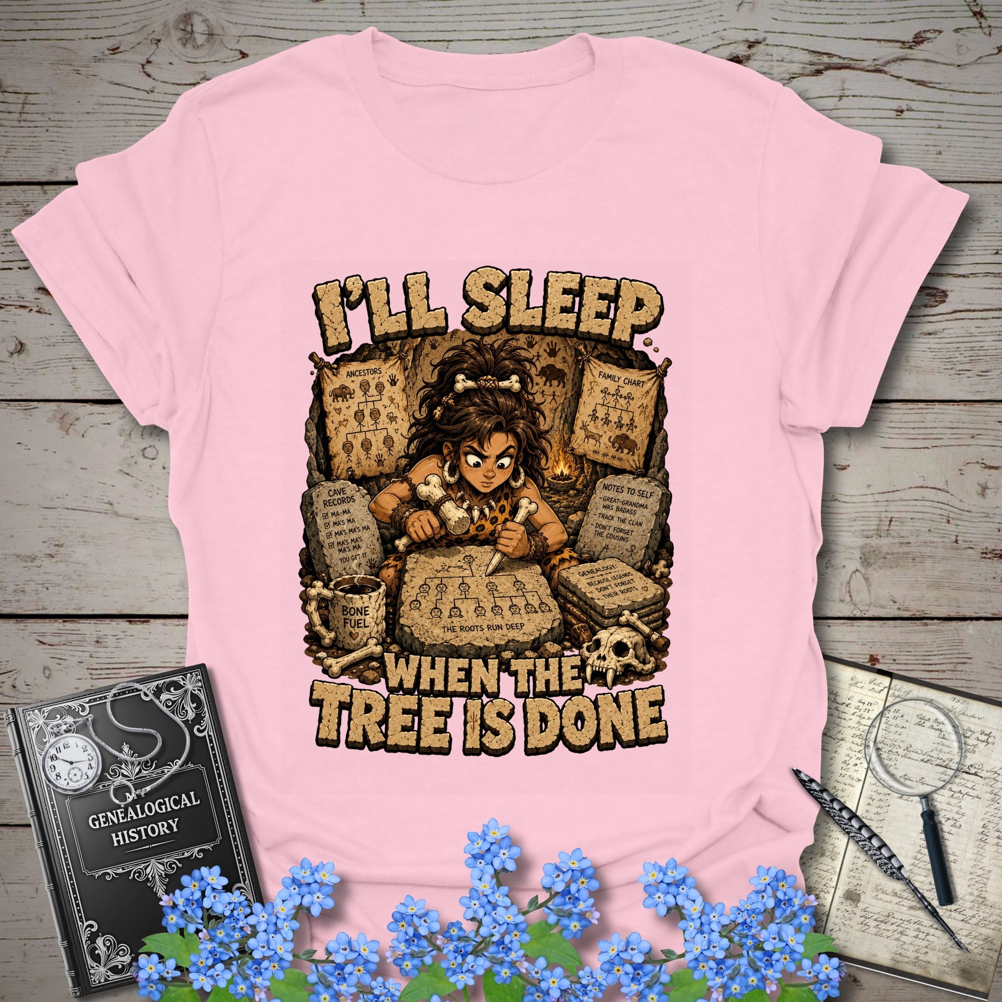 I’ll Sleep When the Tree Is Done – Cavewoman Edition T-Shirt in Light Pink by Genealogy Keepsakes