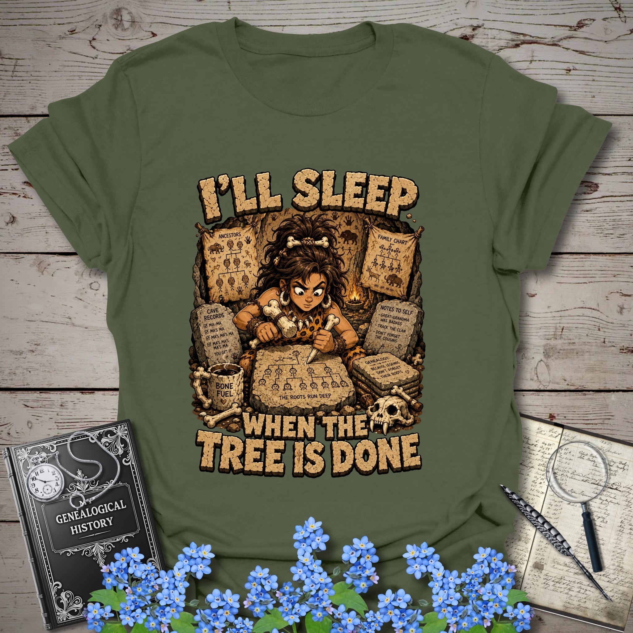 I’ll Sleep When the Tree Is Done – Cavewoman Edition T-Shirt in Military Green by Genealogy Keepsakes