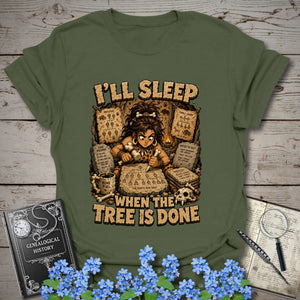 I’ll Sleep When the Tree Is Done – Cavewoman Edition T-Shirt in Military Green by Genealogy Keepsakes