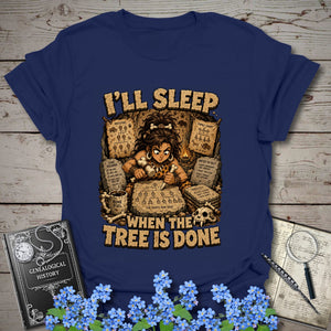 I’ll Sleep When the Tree Is Done – Cavewoman Edition T-Shirt in Navy by Genealogy Keepsakes