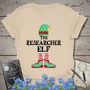 The Researcher Elf T-Shirt in Sand by Genealogy Keepsakes
